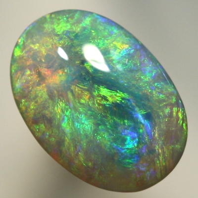 SOLID SEMI BLACK OPAL Pretty opal with orange bursting into greens and blues. SEE VIDEO